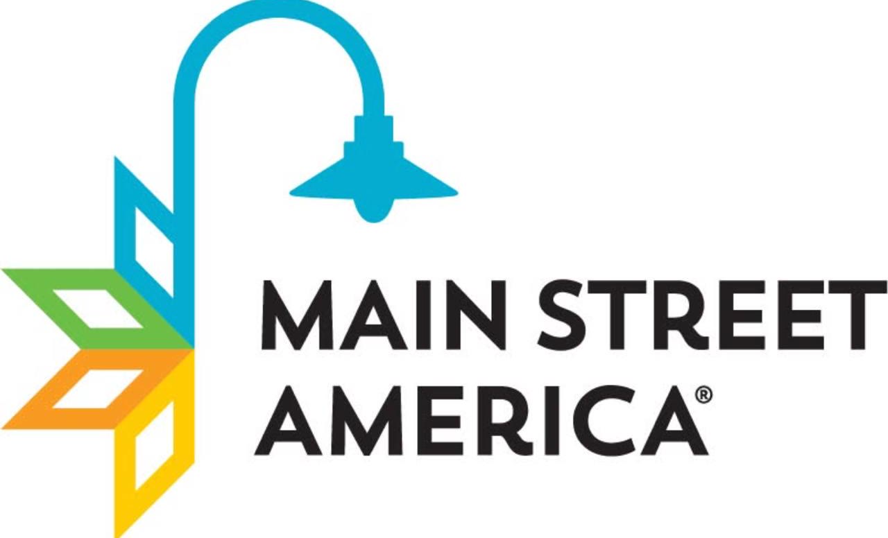 The Main Street America logo: a blue street lamp over green, orange and yellow diamond shapes, beside the words Main Street America.